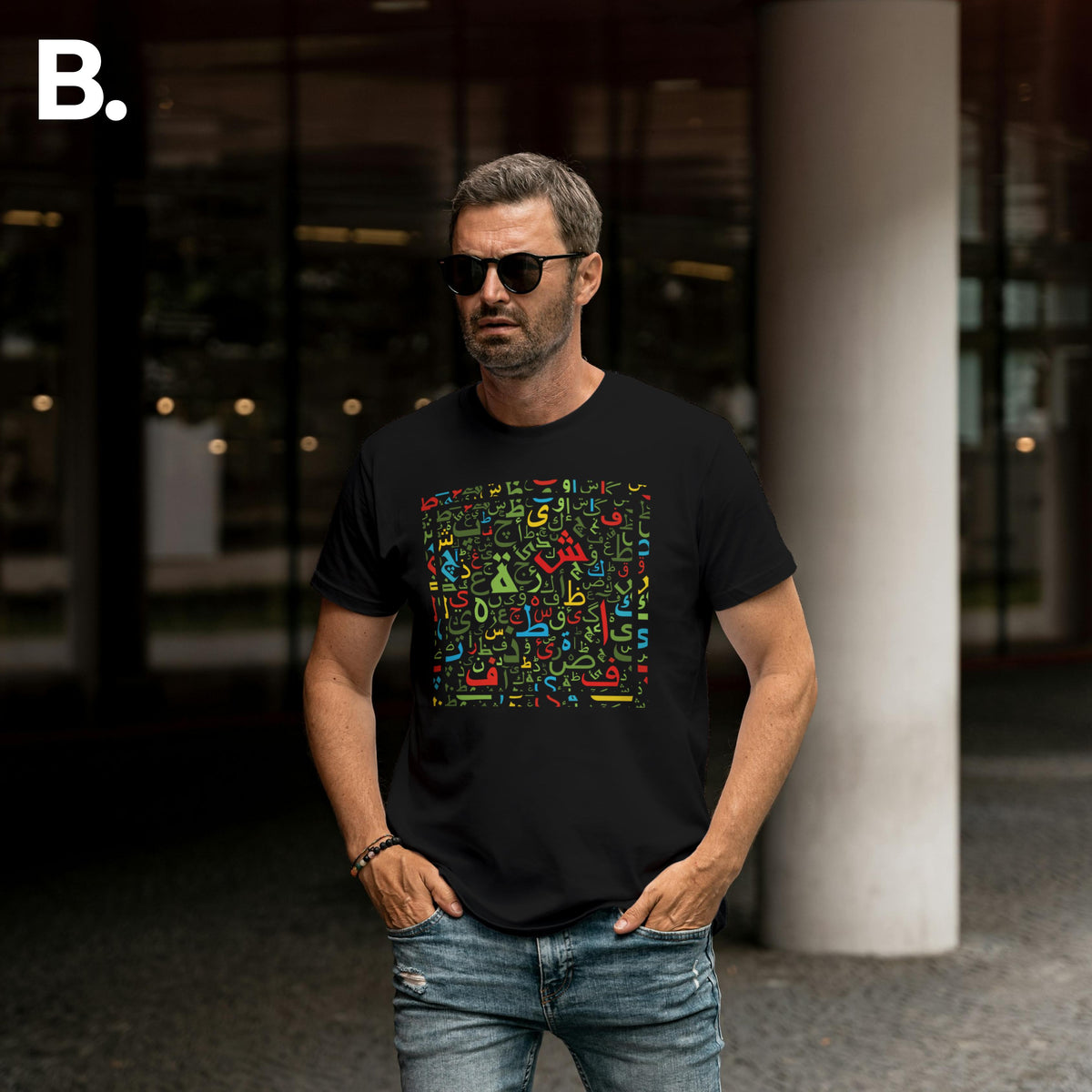 Outdoor front view of a model wearing the black Calli calligraphy tee