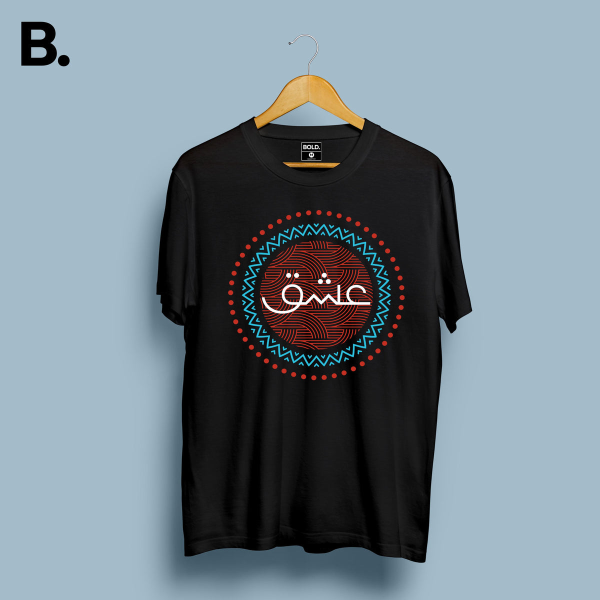 Black Ishq calligraphy tee on a hanger with white Urdu lettering and a red and turquoise circular design