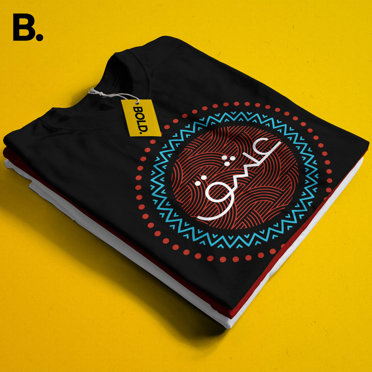 Close-up of the folded black Ishq tee showing white Urdu lettering inside a red and turquoise circular print