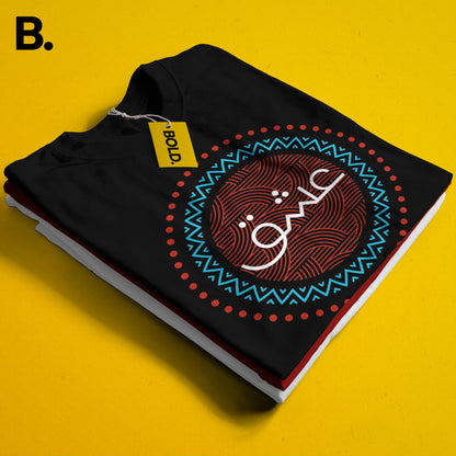 Close-up of the folded black Ishq tee showing white Urdu lettering inside a red and turquoise circular print